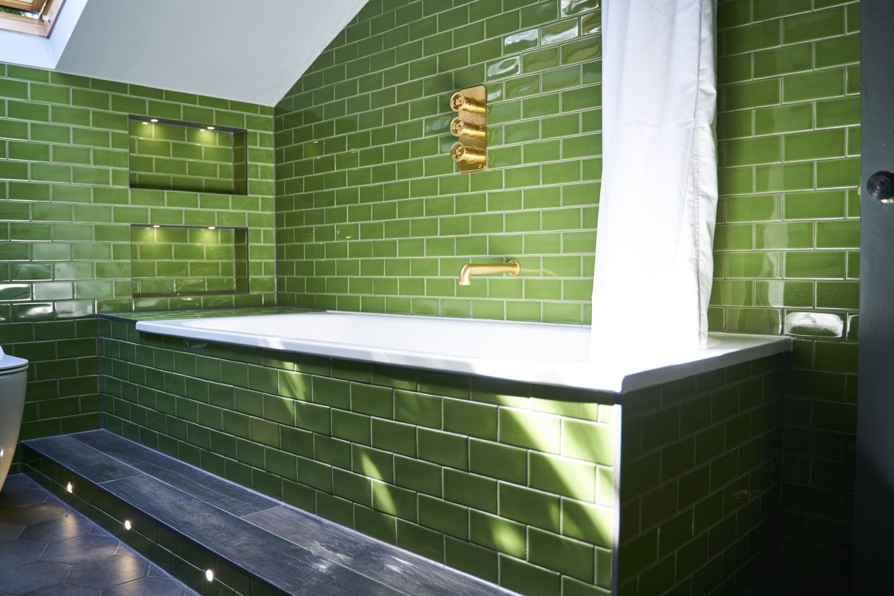 built in bath with tiled panel