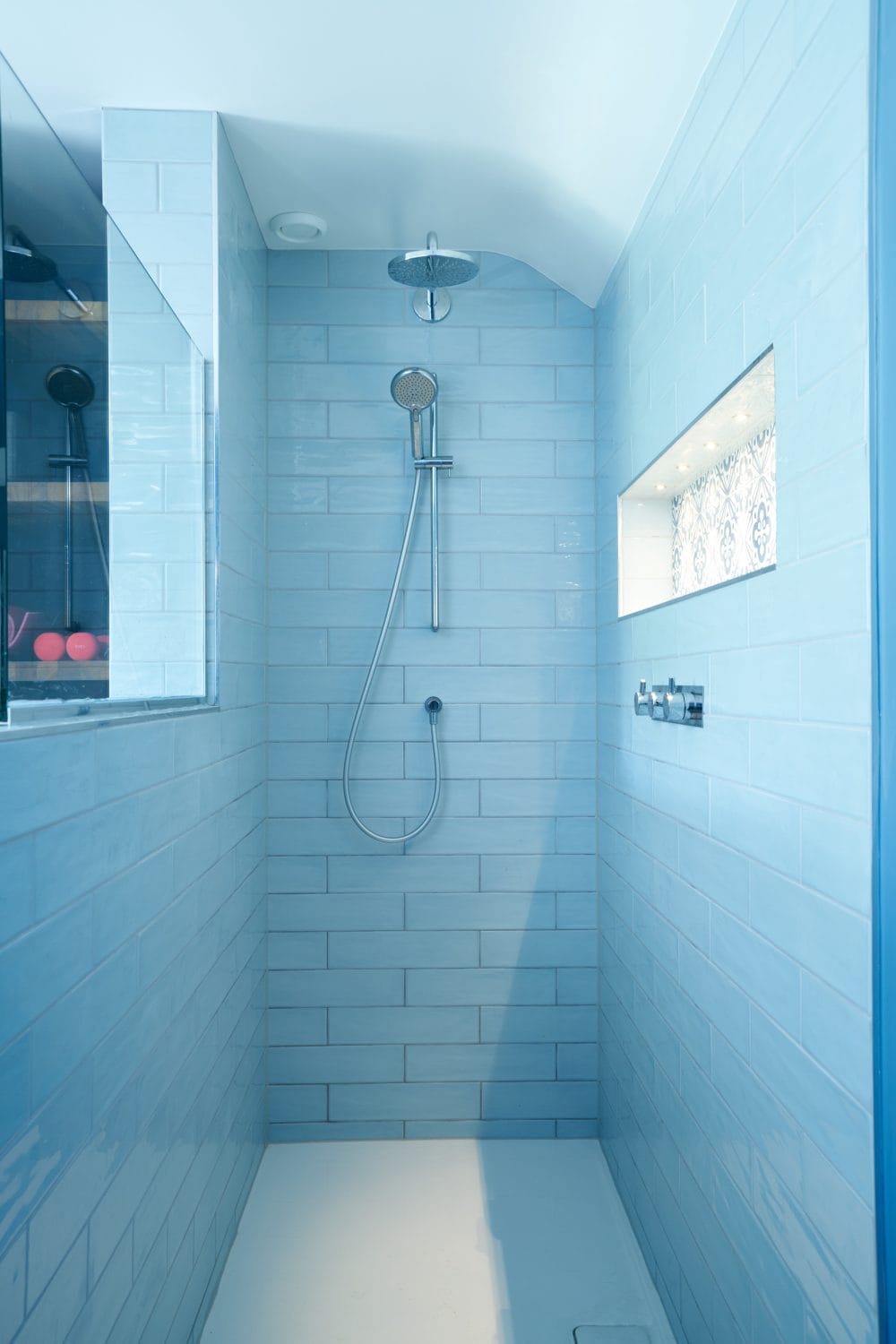 shower enclosure with blue tiles