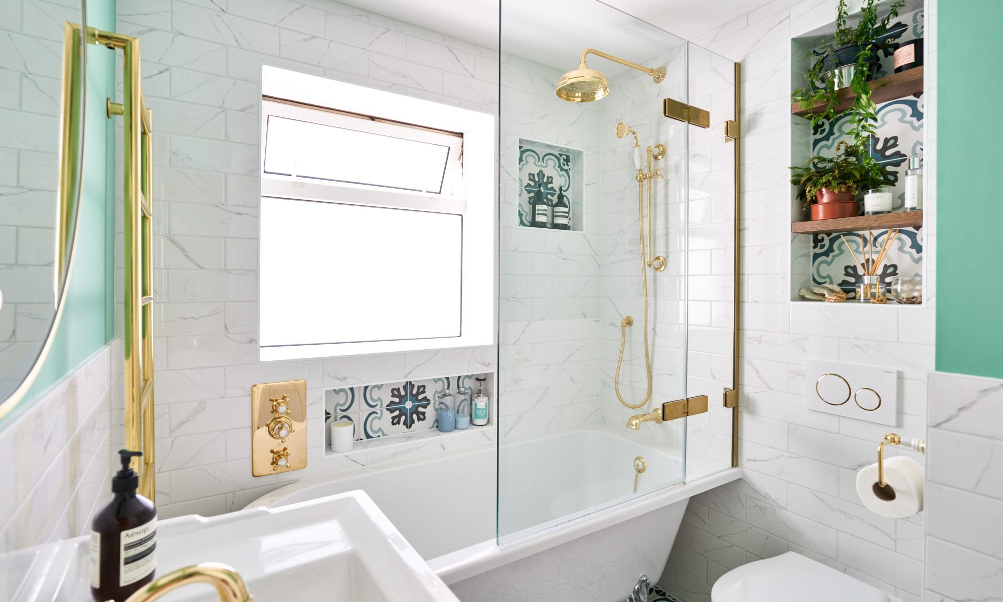 Bath with Patterned Tiles, Gold Shower Valve and Bath Screen