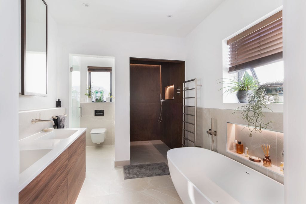 wet room and dark bathroom vanity