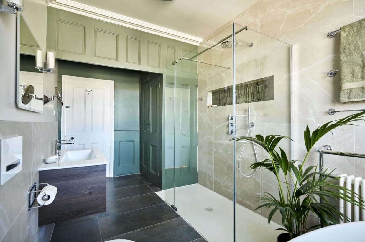 bathroom with wood panelling and large walk in shower