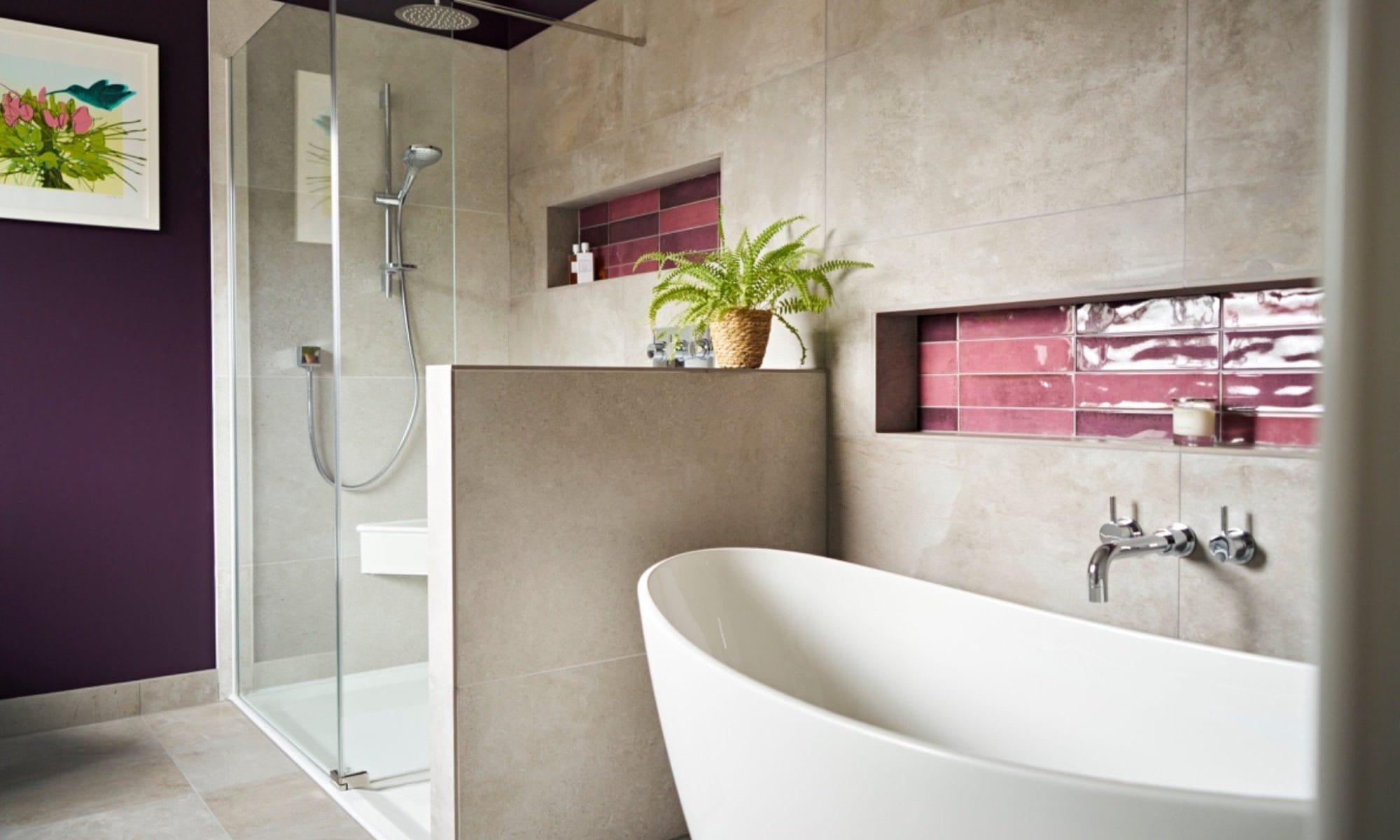 Shower detail with chrome fittings and purple glazed tile niche