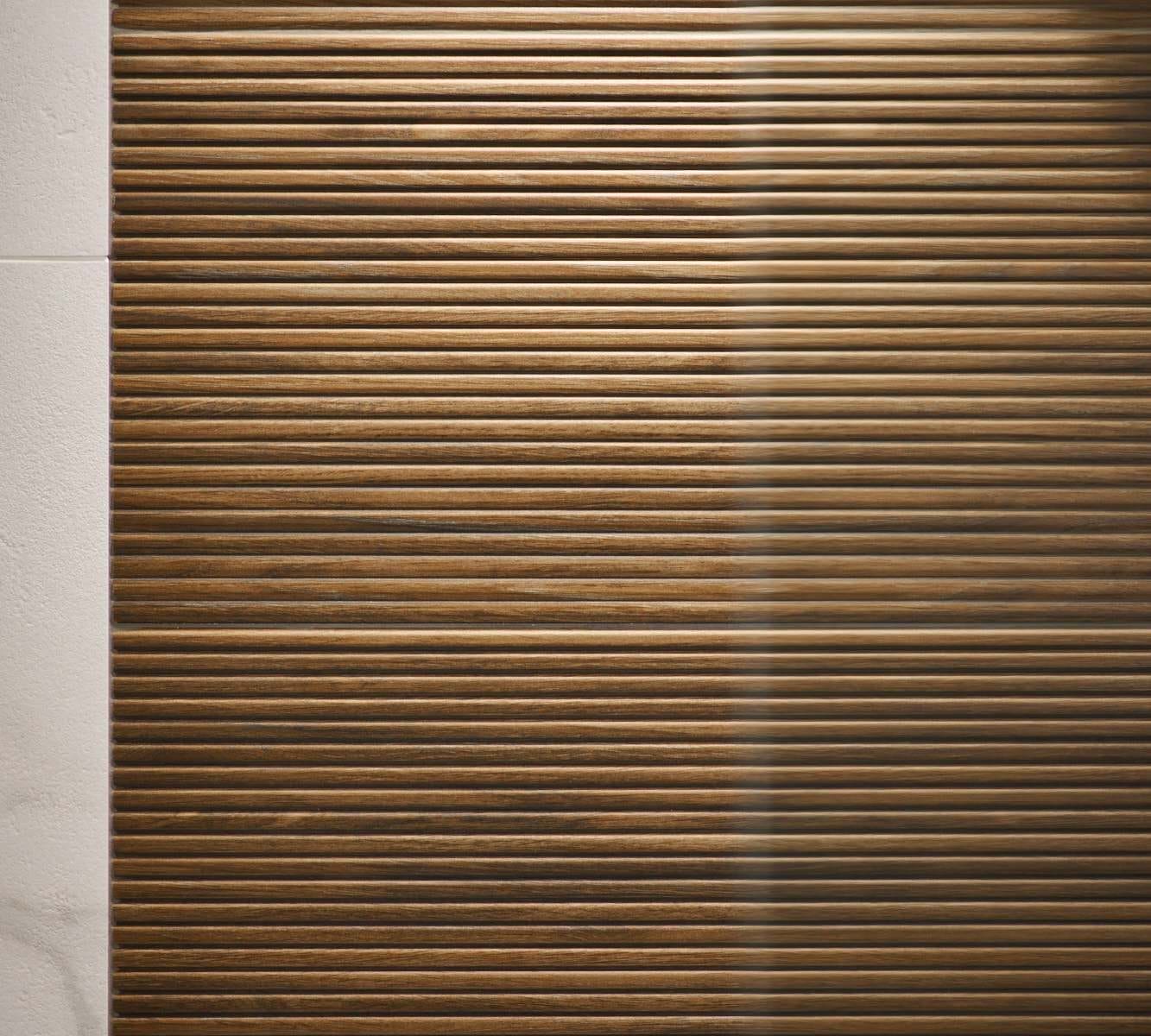 Close-up of vertically ribbed wood‑effect shower feature panel in a modern Sussex bathroom.
